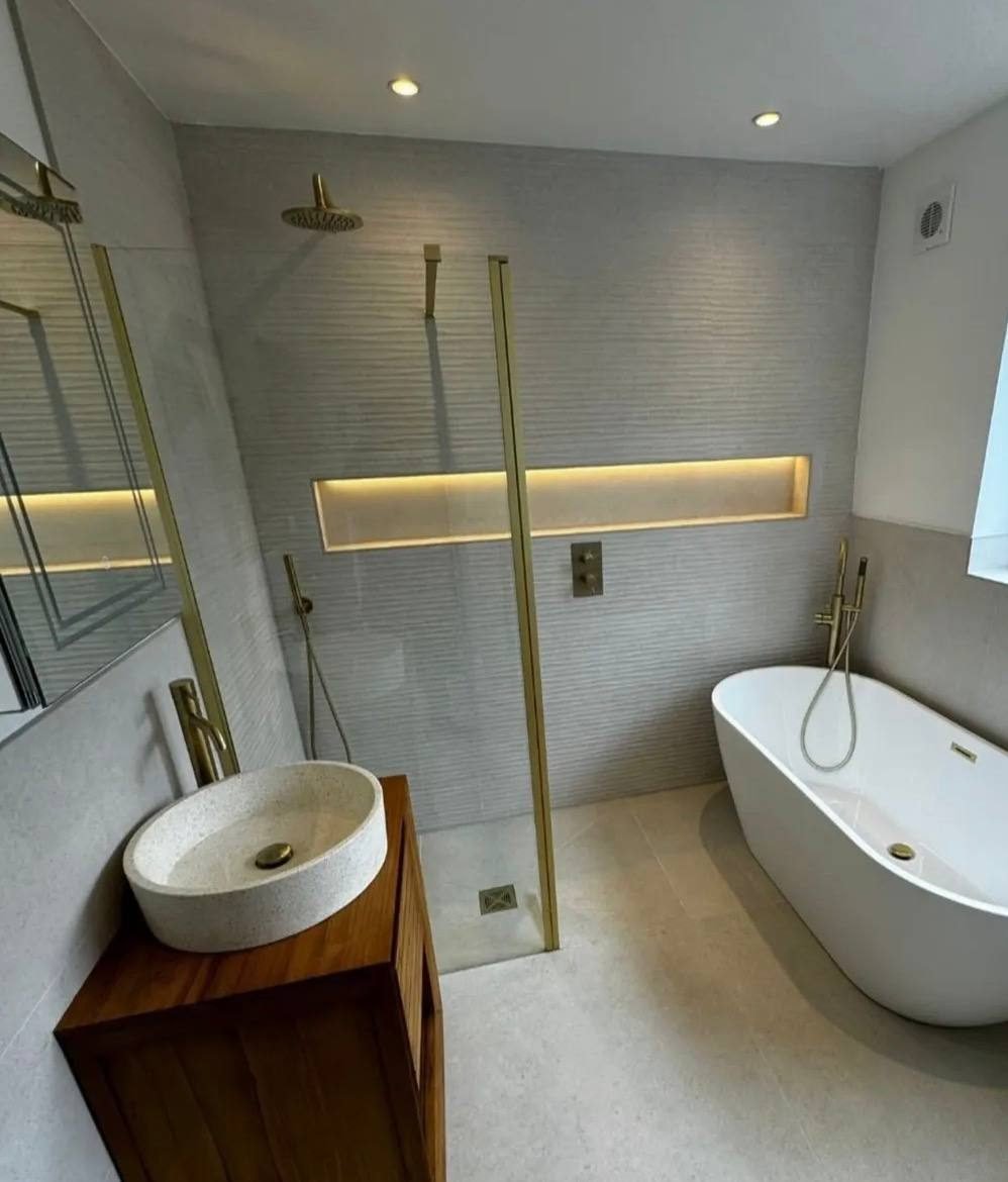 Full luxury bathroom renovation with freestanding bath and brass fittings