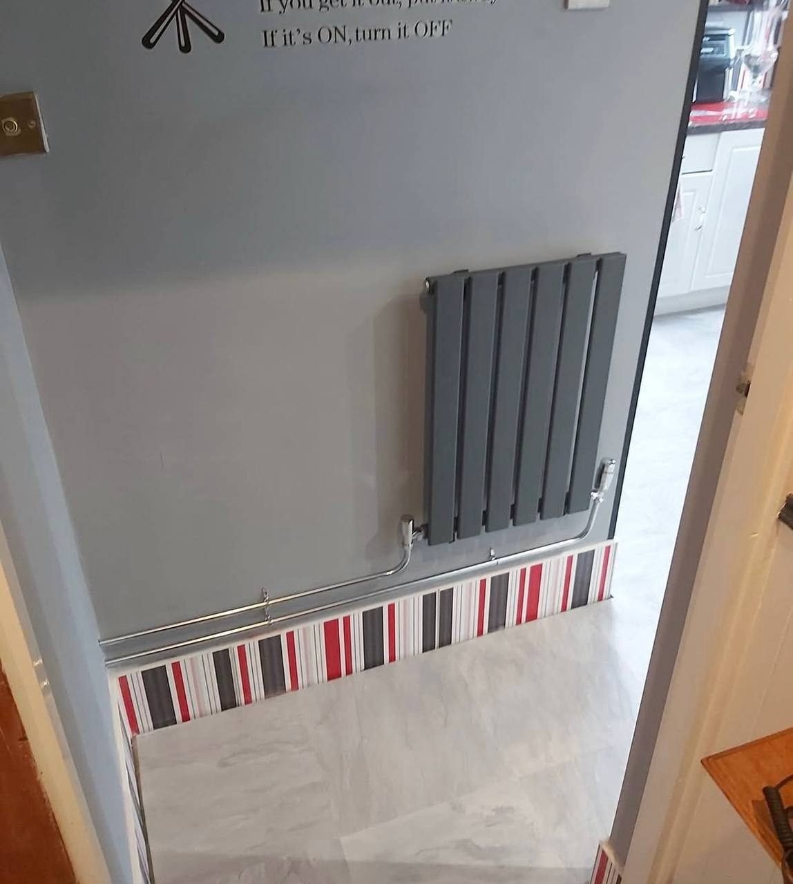 Anthracite designer radiator installation