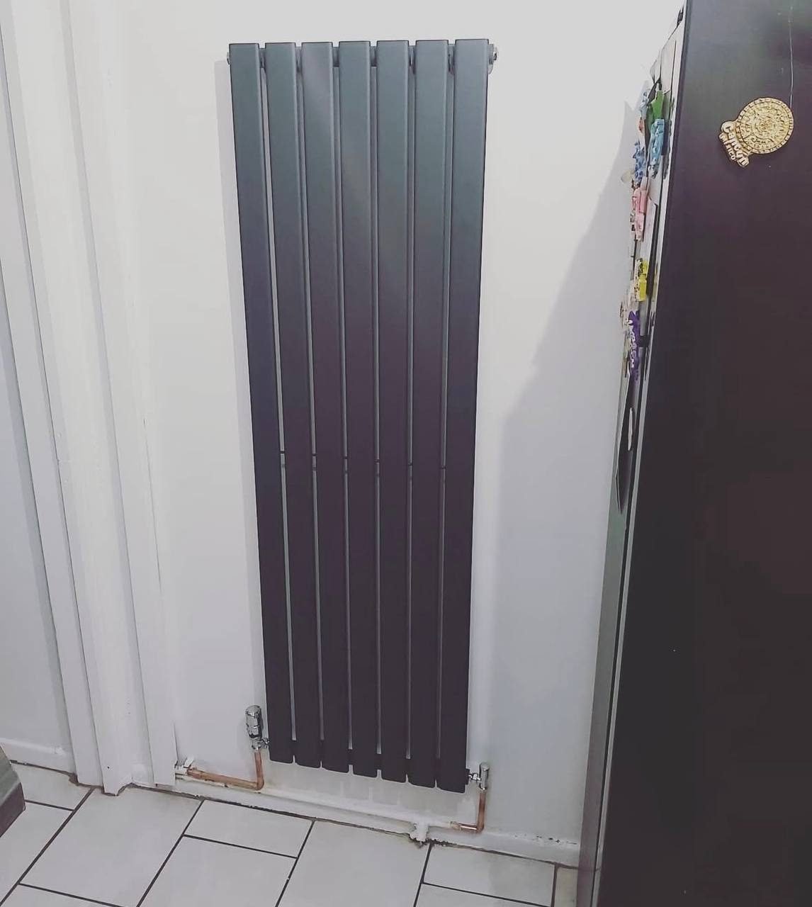 Designer vertical radiator installation in Rotherham